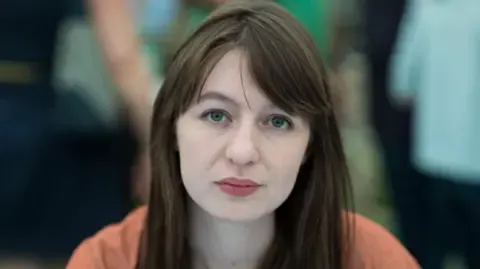 The acclaimed novelist declares she will not enter the UK because of potential arrest